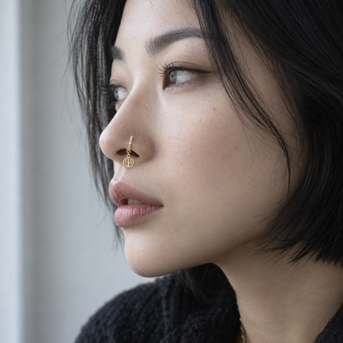 JOAJOA 152 gold crystal Tree of Life hoop nose ring worn naturally on model