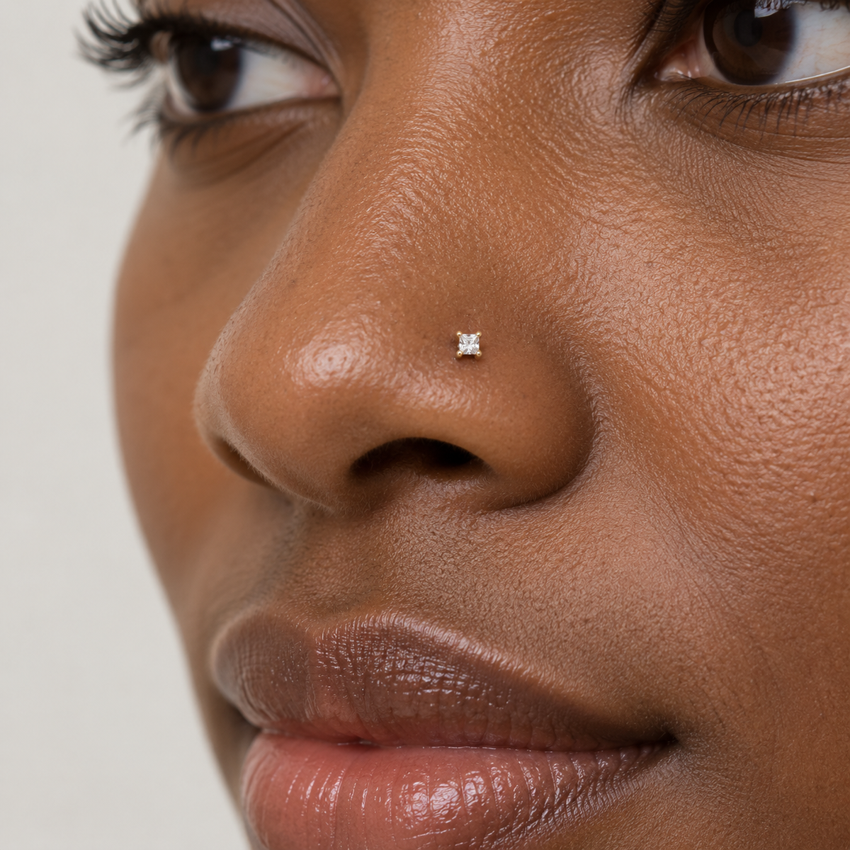 05N small square crystal gold prong nose stud worn on model