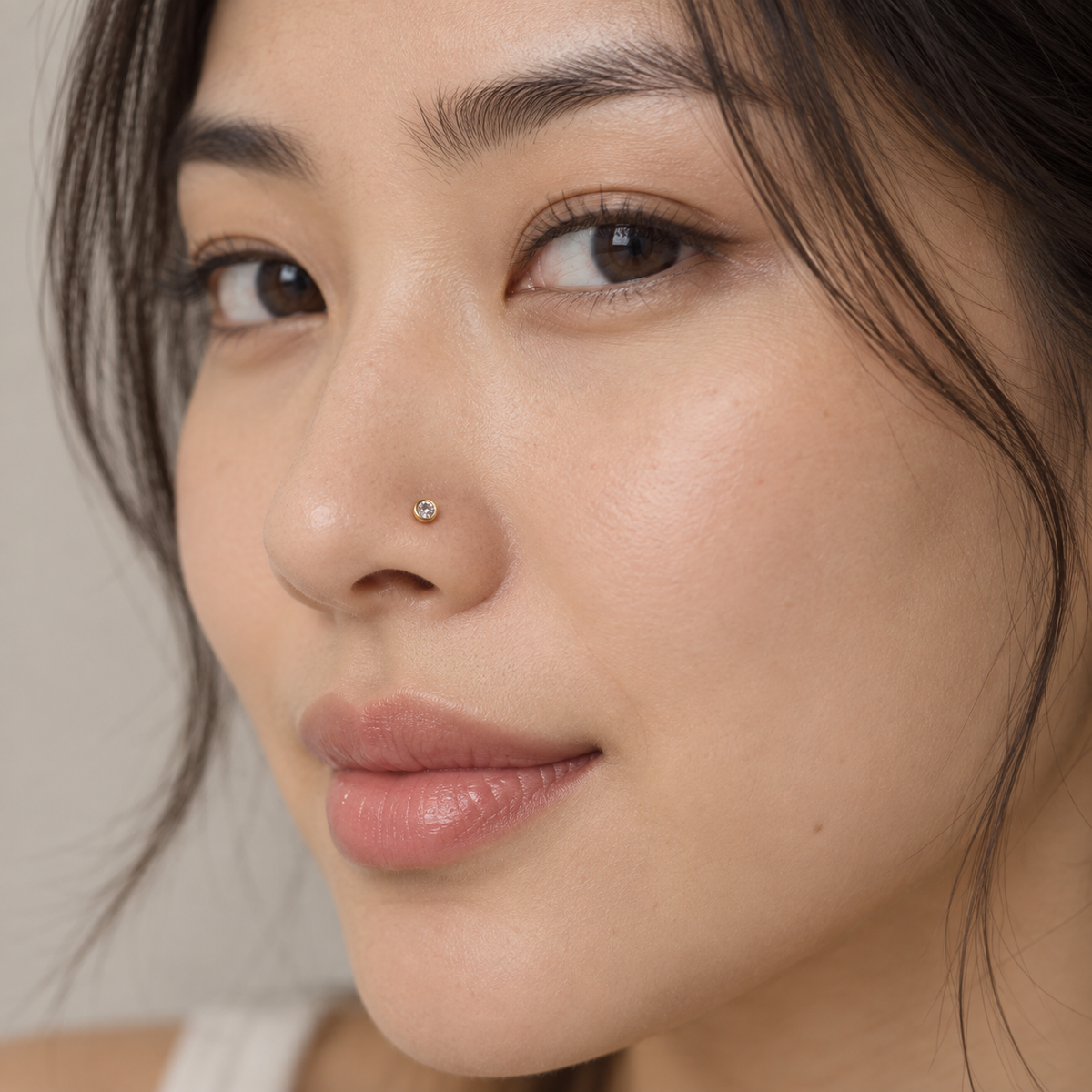 07 small round bezel L-shaped nose stud worn on model