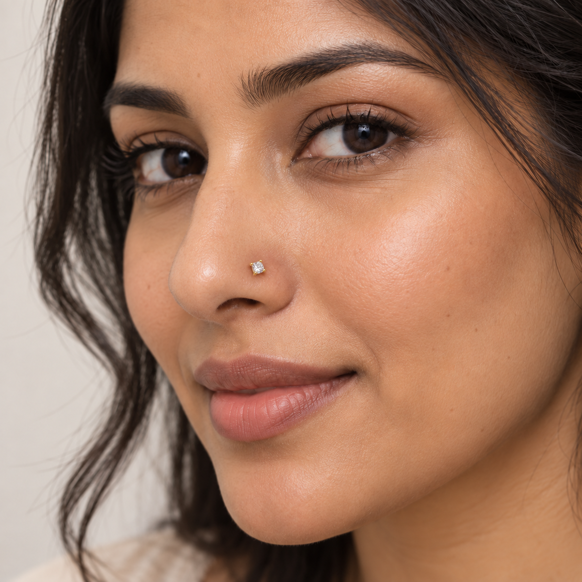 08N large square four-prong L-shaped nose stud worn on model, corrected scale
