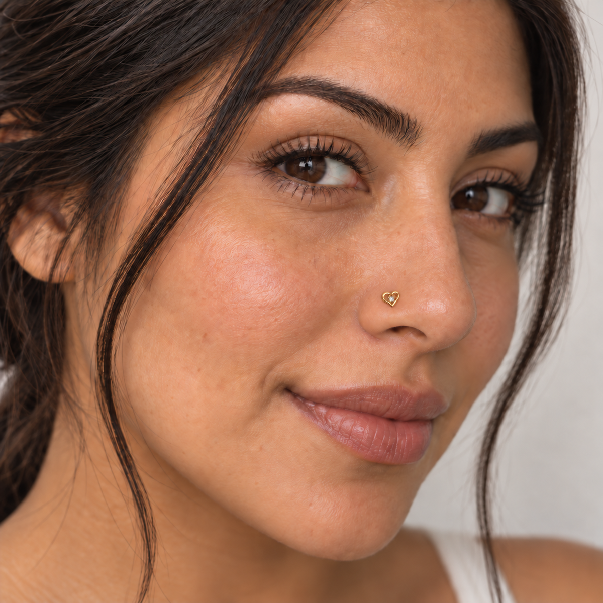 11 small crystal open-heart ball-tip nose stud worn on model