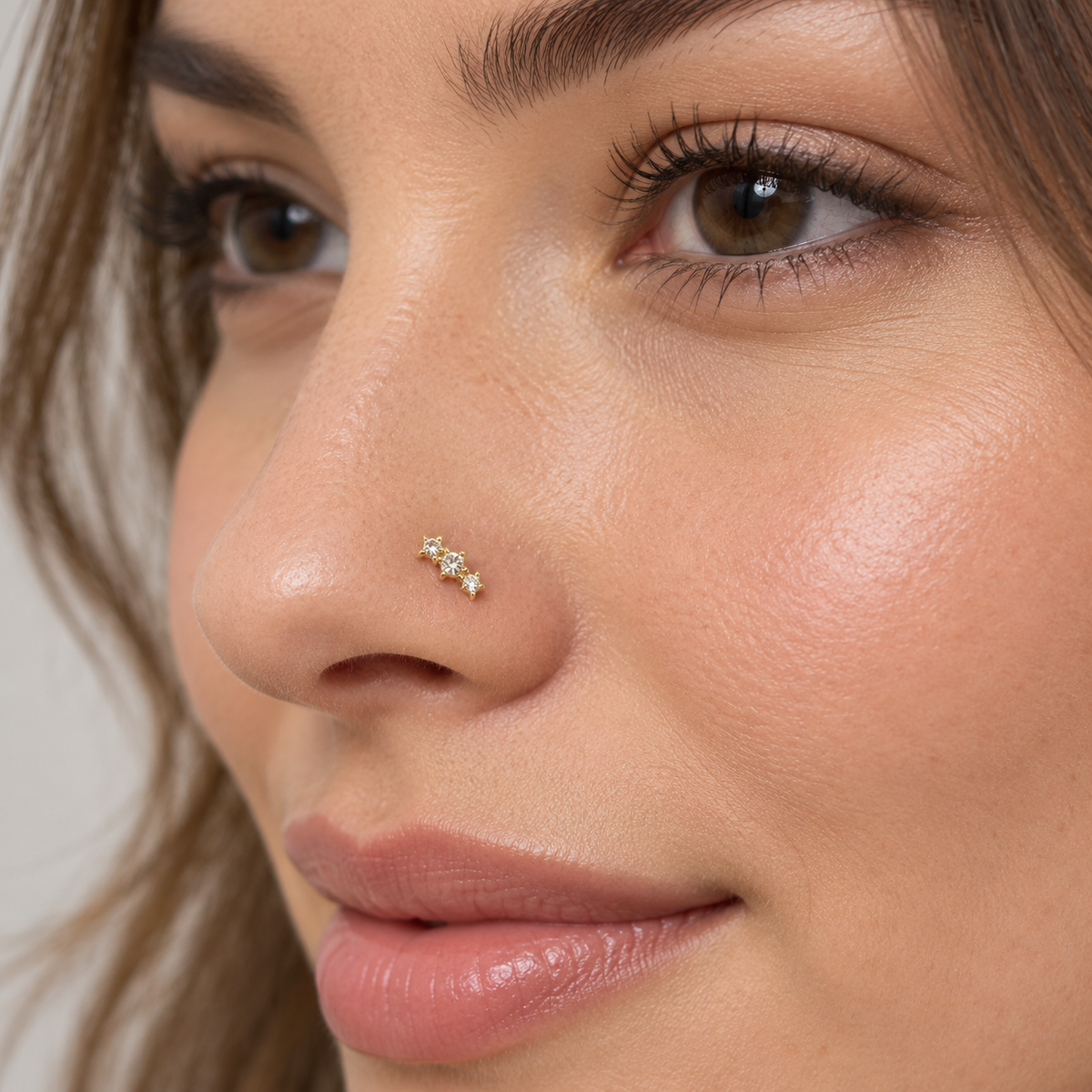 126 Three Star Gold Ball Tip Nose Stud worn on model