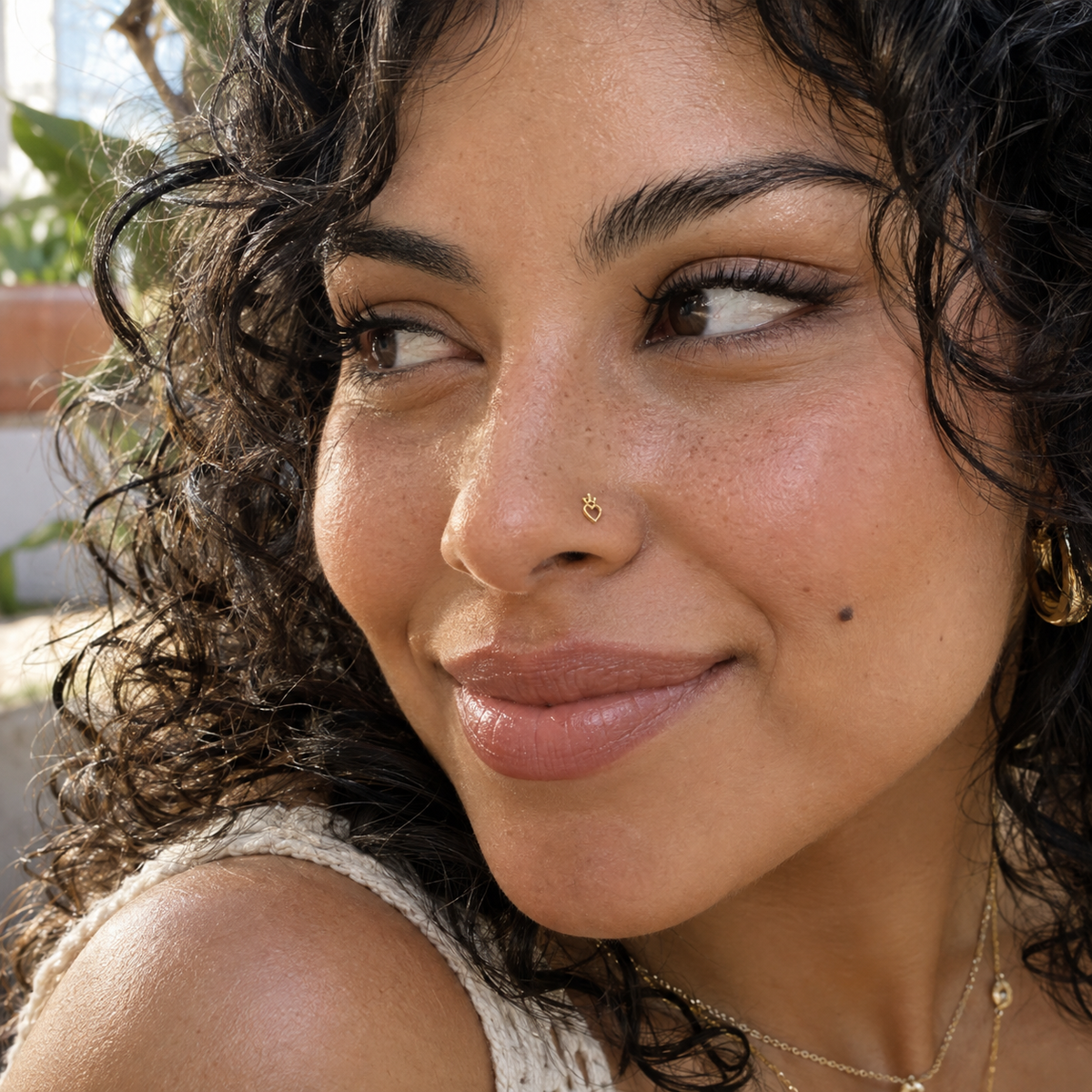JOAJOA 151 gold Heart with Crown L-shaped nose stud worn naturally on model