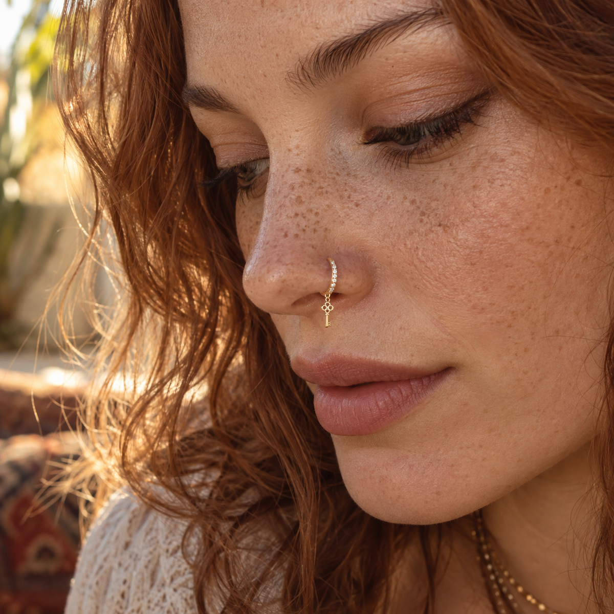 JOAJOA 154 gold crystal Key charm hoop nose ring worn naturally on model