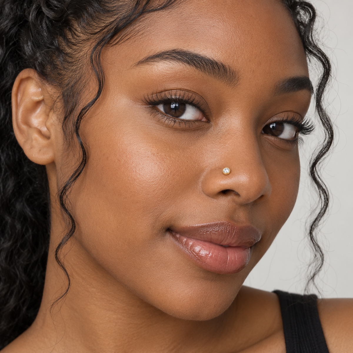 38 3mm gold bezel crystal nose stud worn by model