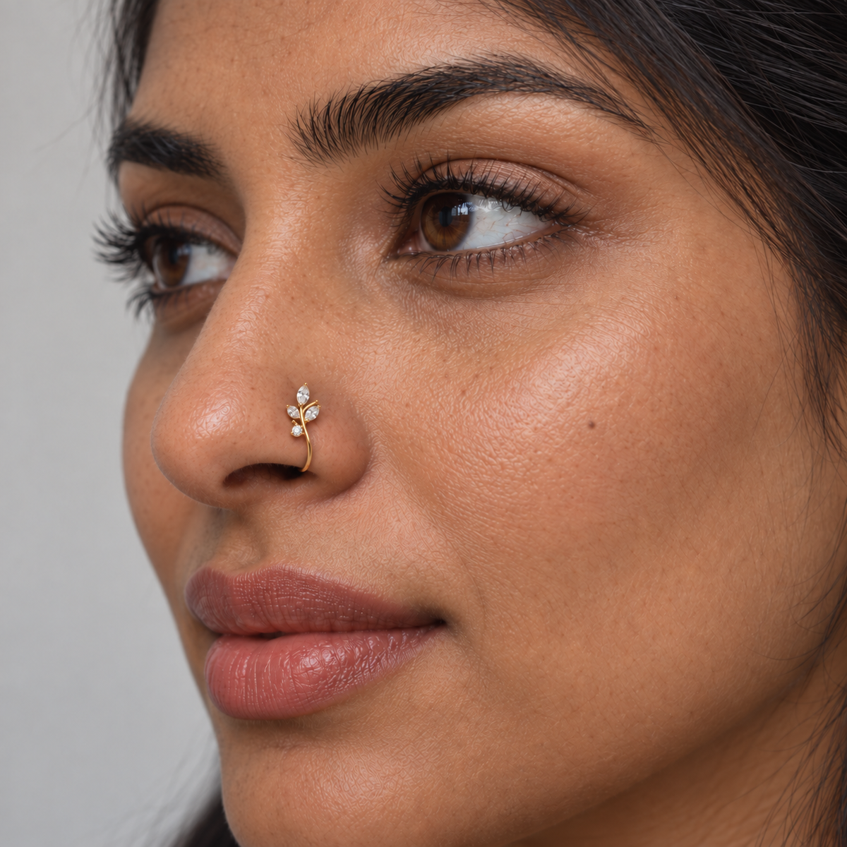 South Asian model wearing a slightly smaller JOAJOA 70 three-leaf crystal clip-on nose ring