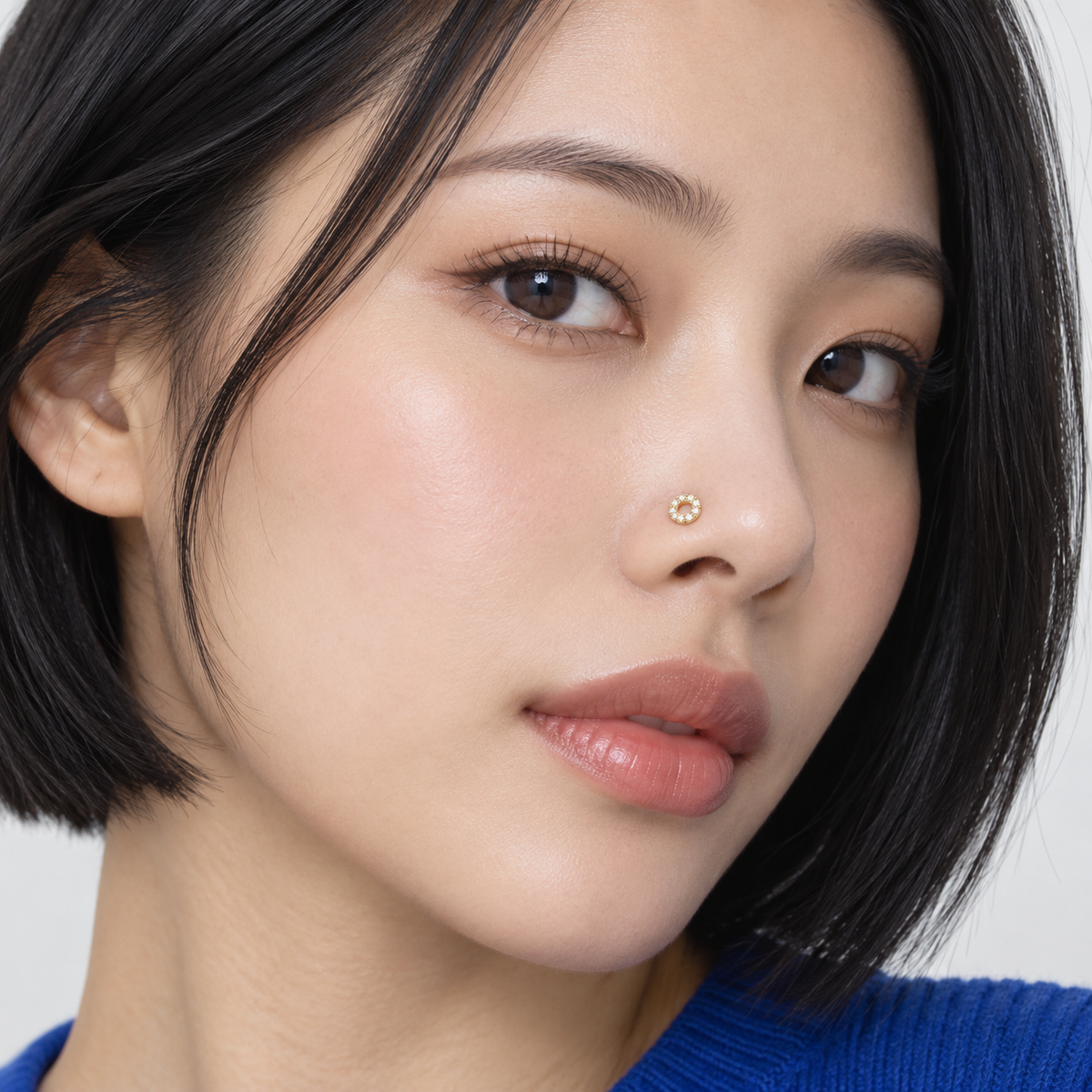 Model wearing JOAJOA 87L Crystal Donut L-Shape Nose Stud