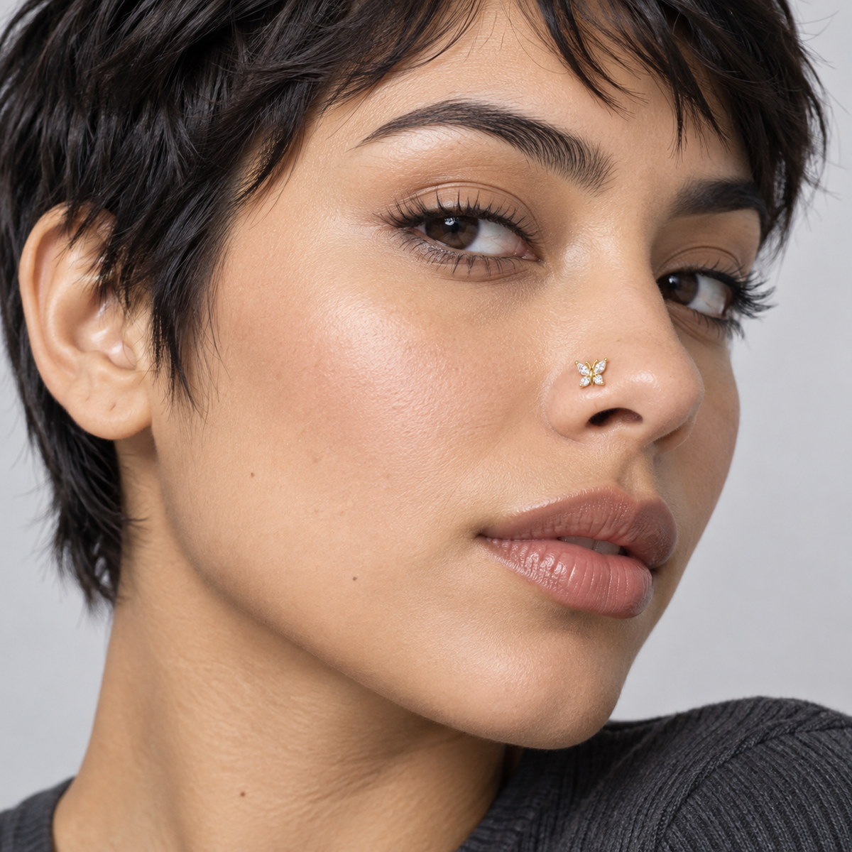 Model wearing JOAJOA 93 Crystal Butterfly Ball Tip Nose Stud