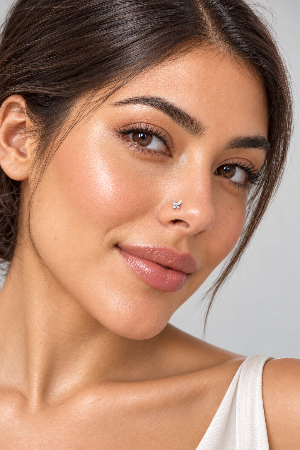 Model wearing JOAJOA 93L Crystal Butterfly L-Shape Nose Stud