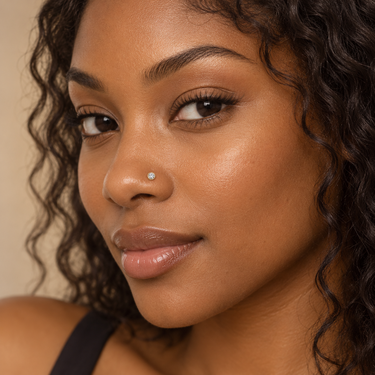 Model wearing JOAJOA 02 gold bezel crystal L-shaped nose stud
